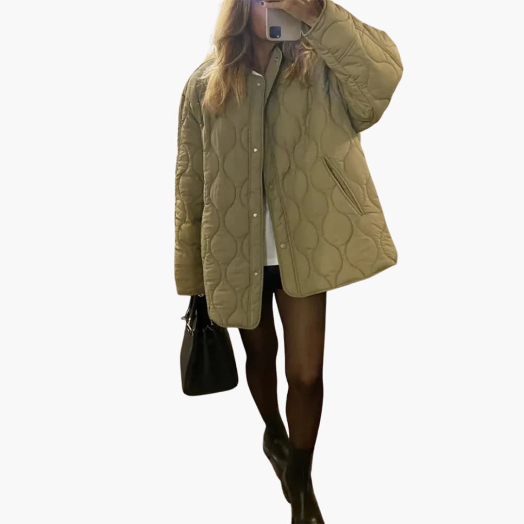 Women's winter puffer jacket with quilted padding and snap closure