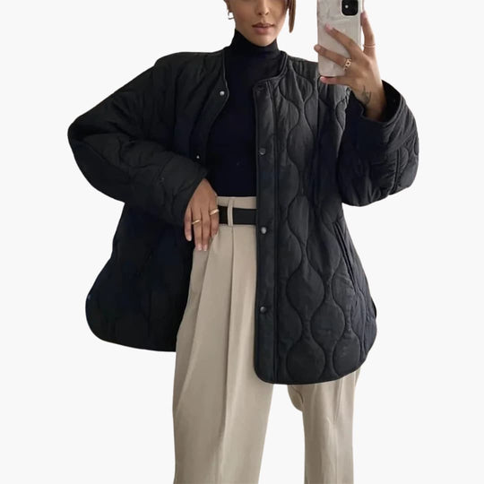 Women's winter puffer jacket with quilted padding and snap closure